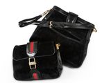 a pair of black purses on a white background