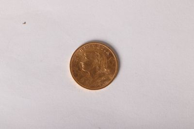 a small coin that is on a white surface
