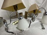 three lamps that are on a table with a lamp on it