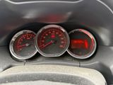 three speedometers on the dashboard of a car