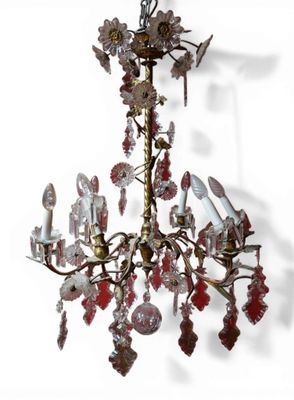 LUSTRE en bronze à six bras de lumières, le fût à enroulemen…