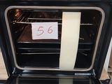 a sign on the door of an oven with a sticker taped to it