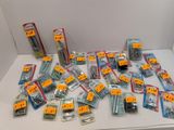 many different types of screws and nuts on the table