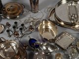 a lot of silver items that are on a table