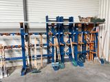 many shovels that are sitting on a rack