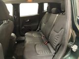 the back seats of a green car with black leather trims