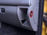 a close up of a car ' s interior with the door open