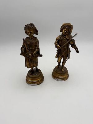 pair of antique bronze figurines of a man and a woman