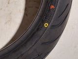 a close up of a tire on a white surface