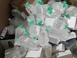 a box full of water bottles and other items in it