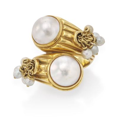 an image of a pair of pearl and gold rings on a white background