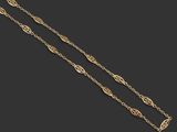 a gold chain with a leaf design on it
