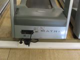 a machine that is sitting on the floor in the room