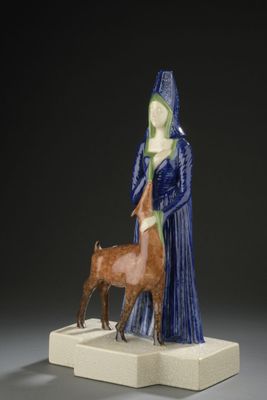 une image représentant une figurine d'une femme et d'un chien