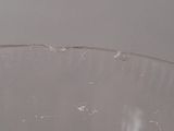 a clear glass bowl with a lot of toothbrushes in it