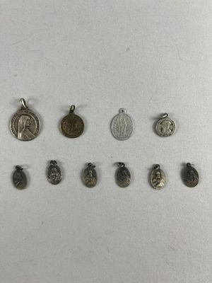 a close up of a group of different metal items on a white surface