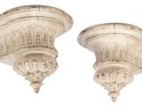 pair of antique white plaster corbs on a white background