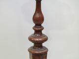 a tall wooden pole with a clock on top of it