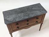 an image of a marble top chest of drawers on a white background