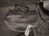 an image of a purse and shoes on the ground