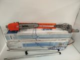 a picture of a chainsaw sitting on top of a stack of boxes