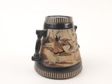 a black and white vase with a painting on it
