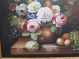 a painting of flowers in a vase with fruit on a table