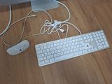 a keyboard and mouse on the floor next to a monitor