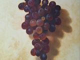 un tableau représentant une grappe de raisin accrochée à un mur