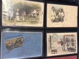 many pictures of people and animals on display in a room