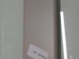 a cell phone that has a sticker on the back of it