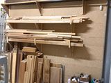 a room that has a lot of wood on the shelves