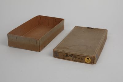 two boxes that are sitting next to each other on a table