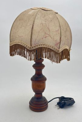 a lamp that has a brown shade on it