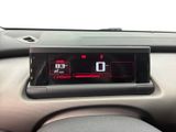 a digital clock on the dashboard of a car