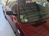 a red car that is parked in a garage