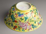 a yellow bowl with a floral design on it