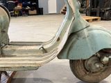 a scooter that is sitting in a garage