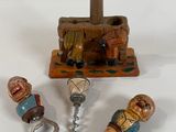 three wine corks and a bottle opener sitting on a table