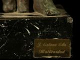 a statue of an elephant with a plaque on it ' s back