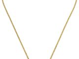 un collier en or avec un pendentif en forme de croix au bout d'une chaîne