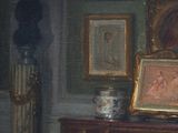 a painting on a dresser in a room with pictures on the wall