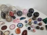 a lot of different types of stones on the table