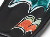 an image of a black plate with a colorful wave design on it