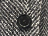 a close up of a jacket with a button on it