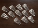 a lot of empty plastic cups on a wooden table