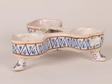 pair of blue and white porcelain dog bowls on stand