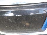a close up of a car ' s bumper with a hole in it