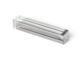 rectangular clear acrylic block with metal base on a white background