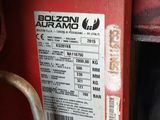 a close up of a red machine with a label on it